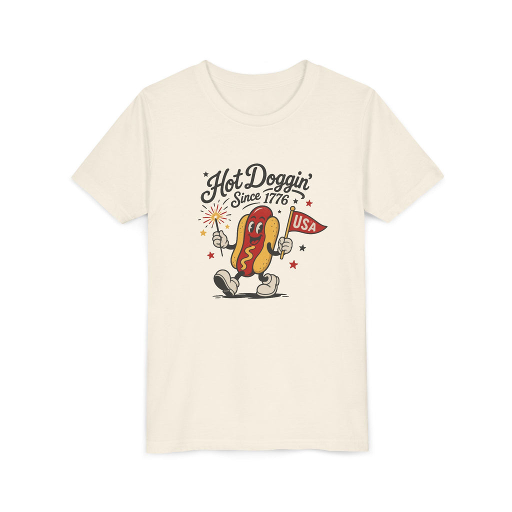 Hot Doggin Since 1776 Tee, Patriotic USA Hot Dog Shirt, Funny Summer Cartoon Graphic Top, Fourth of July Celebration Outfit Youth Short Sleeve Tee