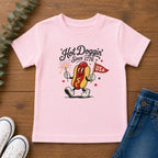 Hot Doggin Since 1776 Tee, Patriotic USA Hot Dog Shirt, Funny Summer Cartoon Graphic Top, Fourth of July Celebration Outfit Youth Short Sleeve Tee